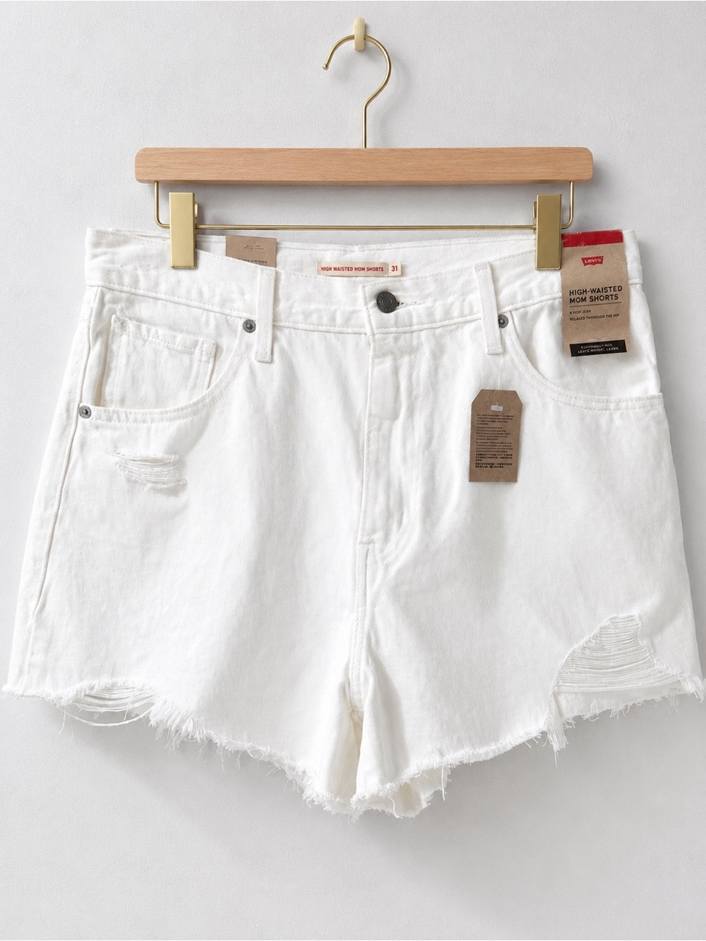 Leviβs High Waisted Mom Jean Shorts White Distressed Size 31 NWT Raw Hem